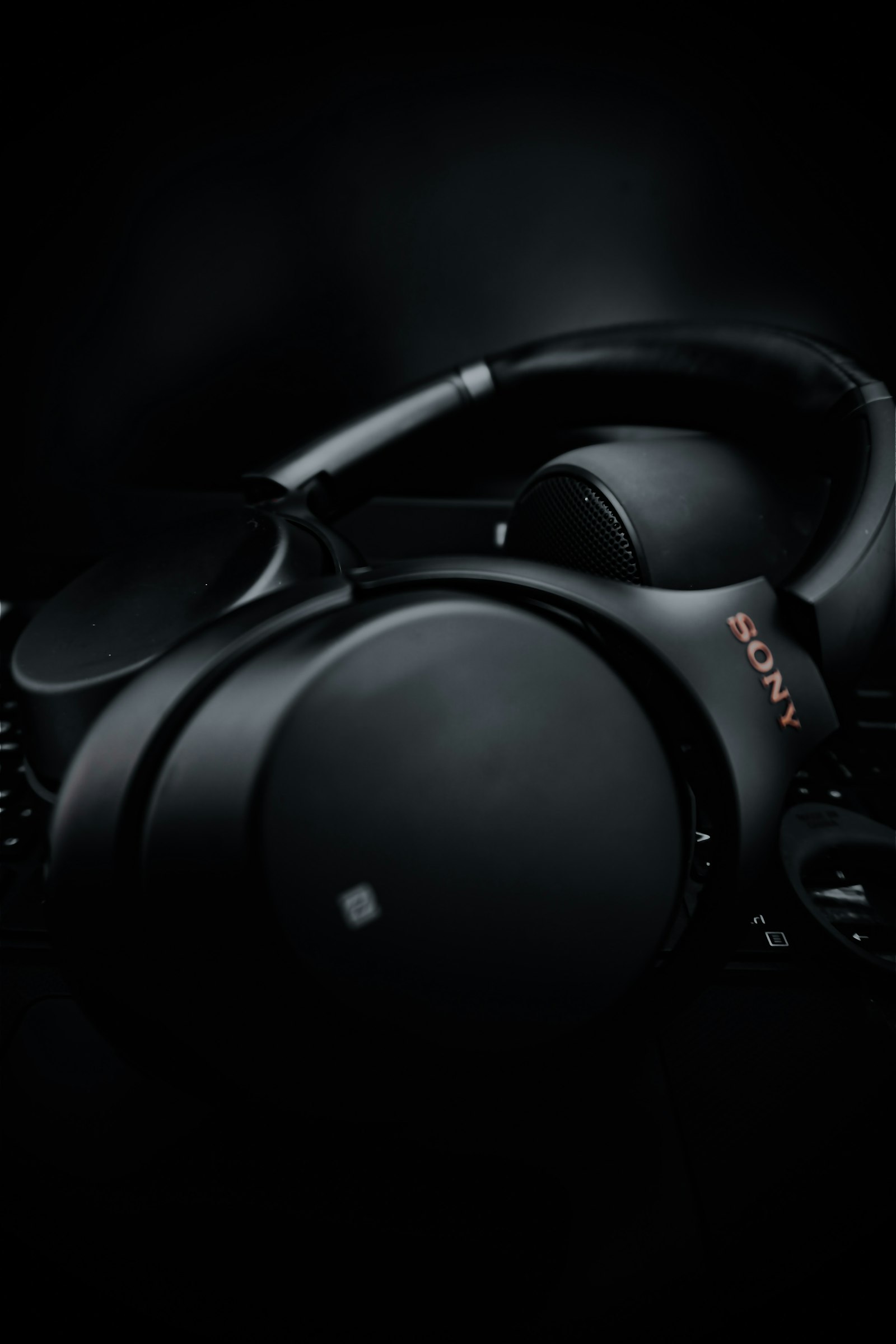 Frame from the generated product video: the headphones in close-up on black
