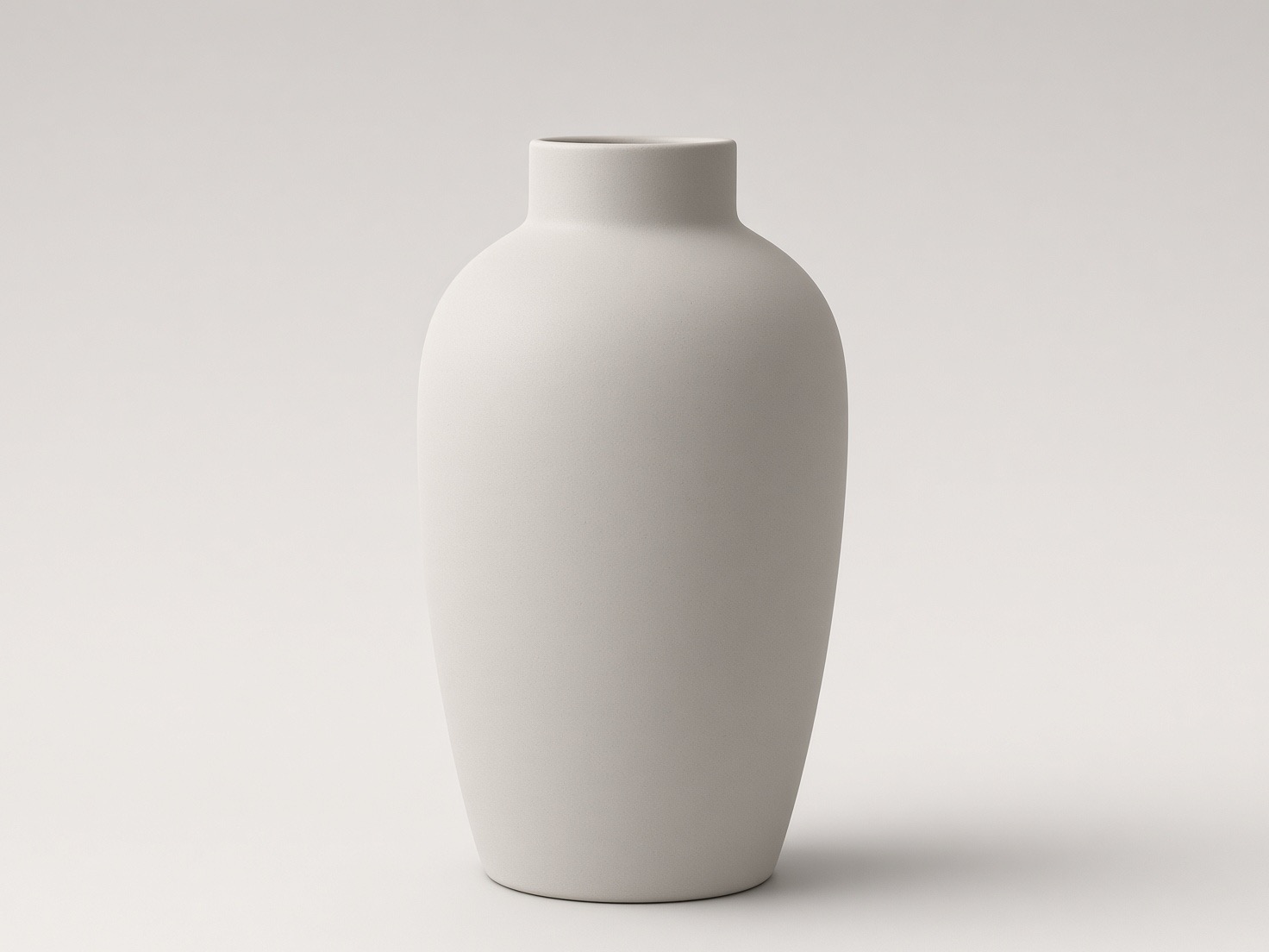 Studio packshot: the white ceramic vase